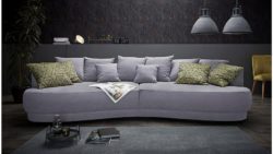 Inosign Big-Sofa »Vany« in gerundeter Optik mit vielen losen Kissen